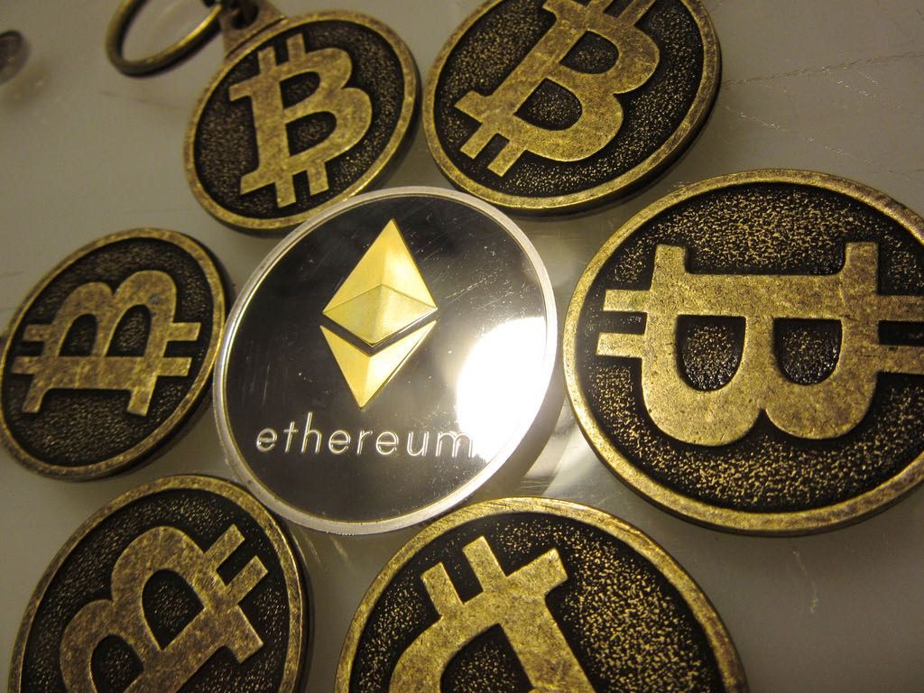 An Ethereum token surrounded by Bitcoins